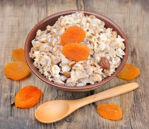 Porridge with dried apricots — Stock Photo, Image