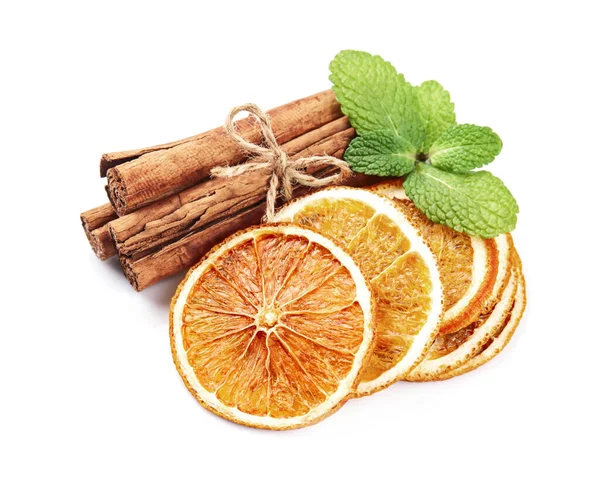 Dried Oranges Slick Cinnamon Pods Mint Leaves White Backgrounds — Stock Photo, Image