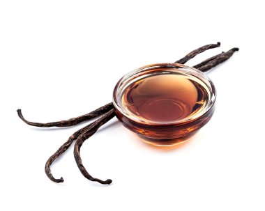 Vanilya ve vanilya özütü beyaz arka planda..