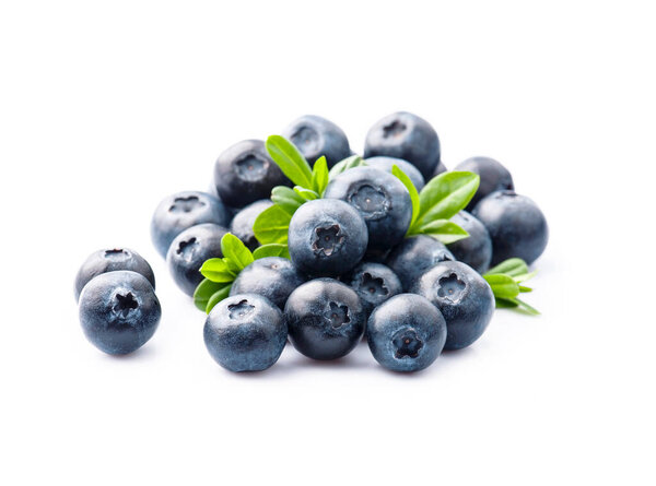 Ripe blueberries with leaves on white backgrounds.