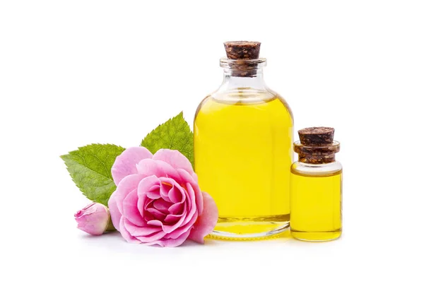 化妆品油 玫瑰和花朵的精华 白色背景的玫瑰 图库图片