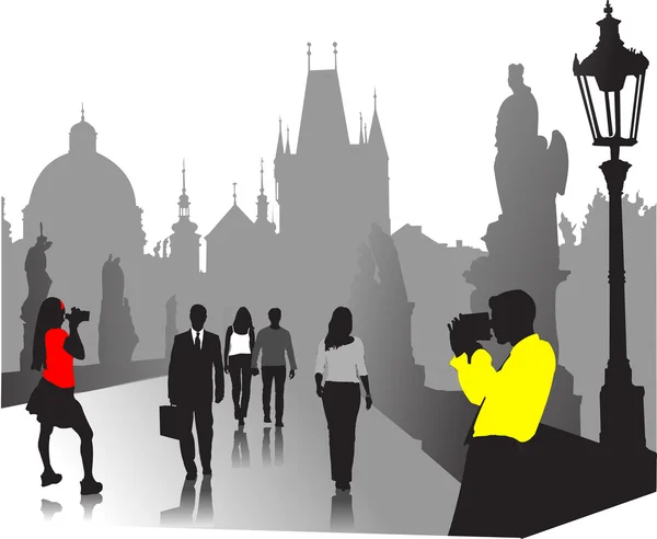 People silhouettes in old town — Stock Vector