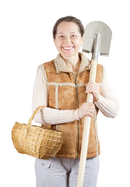 Woman with spade and basket — Stock Photo, Image