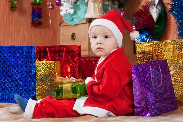 Boy dressed like Santa Claus Stock Picture