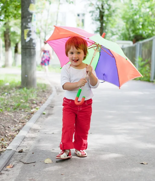 Happy 2 years girl with umbrella — Stock Photo, Image