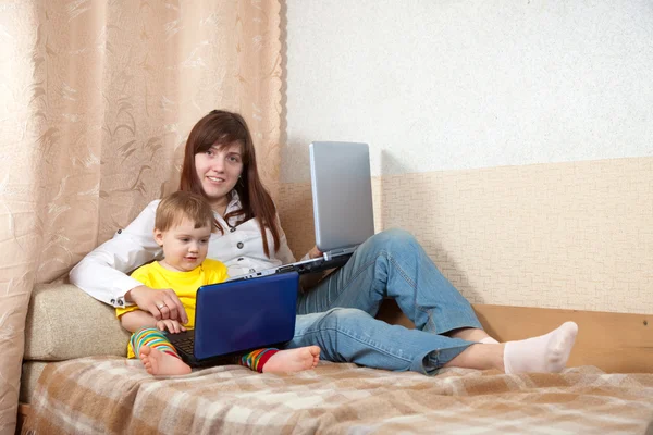 Mother and child with laptops — Stock Photo, Image