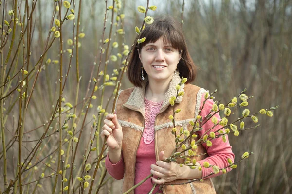 Woman in spring pussywillow plant — Stock Photo, Image