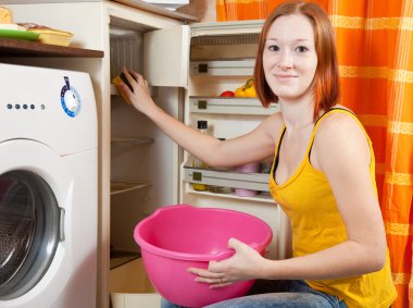 woman cleaning the refrigerator clipart
