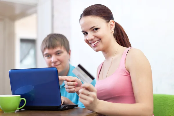 Happy couple doing shopping in internet — Stock Photo, Image