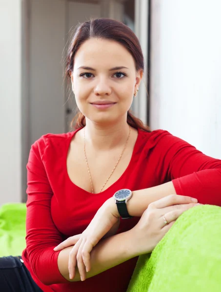 Beauty woman in red at home — Stock Photo, Image