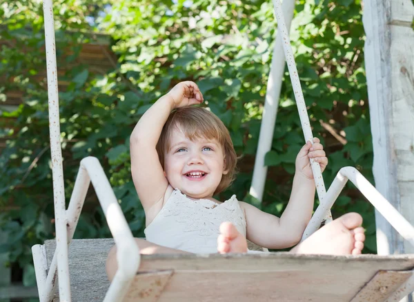 Laughing girl on swing — Stock Photo, Image