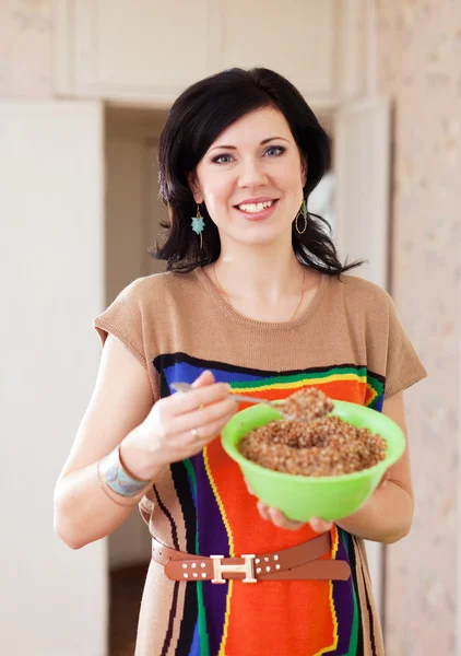 Woman with buckwheat — Stock Photo, Image