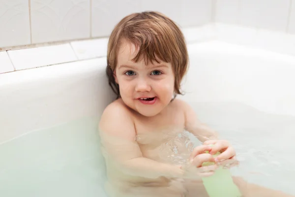 Two-year kid bathes in bath — Stock Photo, Image