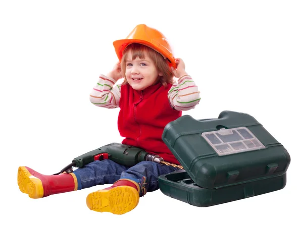 Happy child in hardhat with tools — Stock Photo, Image