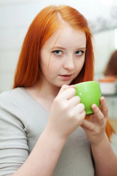 Red-haired teen girl gargling throat — Stock Photo, Image