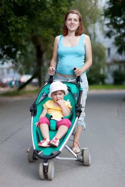 Pregnancy woman with stroller — Stock Photo, Image