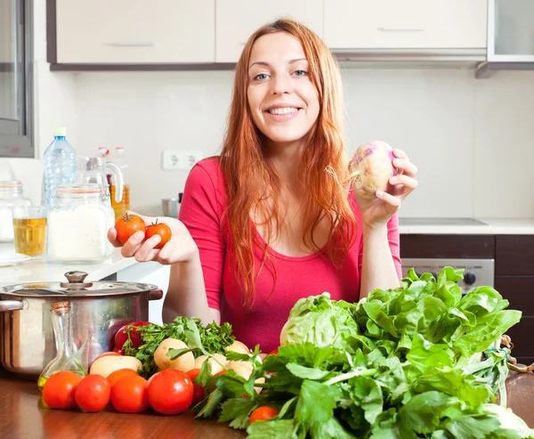 Woman with vegetables and greens — Stock Photo, Image