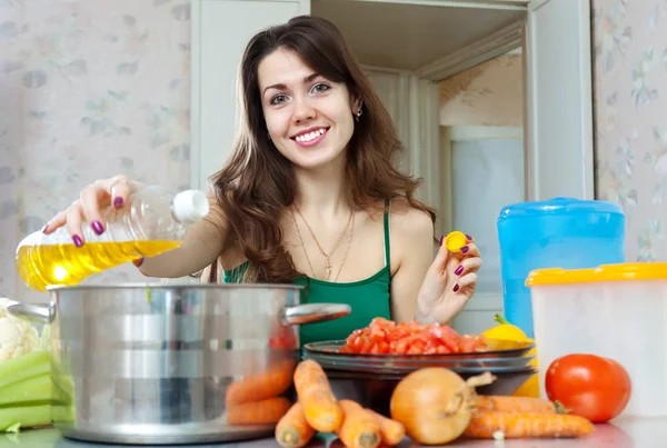 Housewife cook with oil — Stock Photo, Image