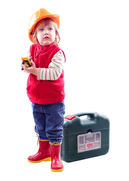 Barn i hardhat med arbetsredskap — Stockfoto