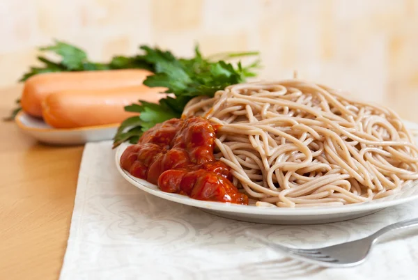 Spaghetti pasta with sausages — Stock Photo, Image