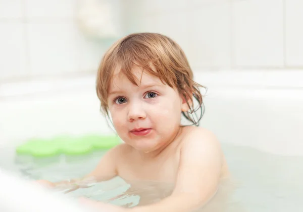 Child bathes in bathtub Royalty Free Stock Images