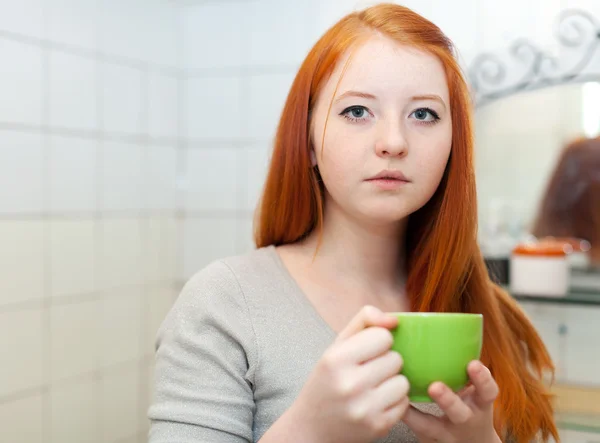 Teenager with cup of medicine gargling — Stock Photo, Image