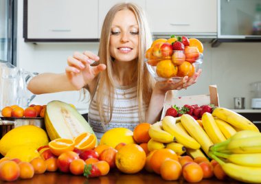 woman taking fruits from table clipart