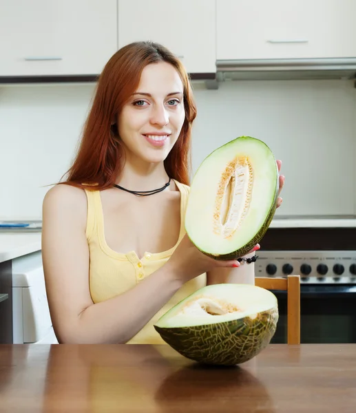 Woman with ripe melon in home — Stock Photo, Image