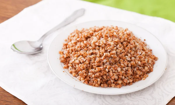 Buckwheat in plate — Stock Photo, Image