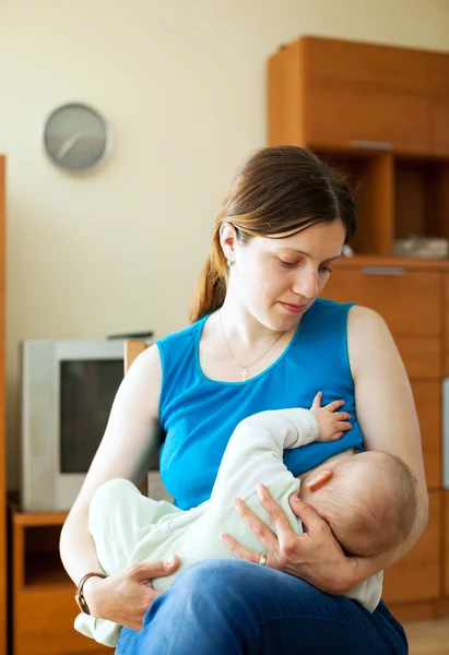 Mother breast feeding baby at home — Stock Photo, Image