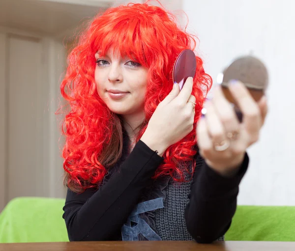 Woman in red periwig stock image everypixel