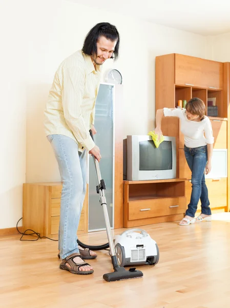 Happy middle-aged couple doing housework — Stock Photo, Image