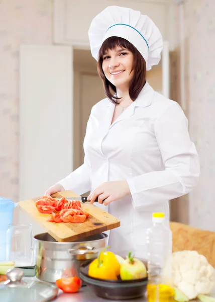 Female cook with tomatoes — Stock Photo, Image