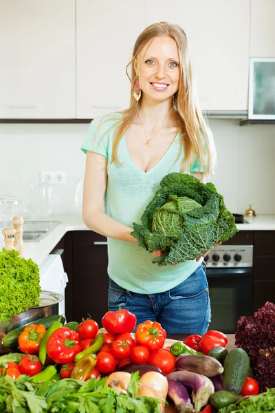 Beautiful woman with vegetables and greens — Stock Photo, Image
