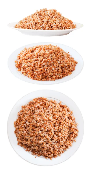 Set of buckwheat in plates over white — Stock Photo, Image