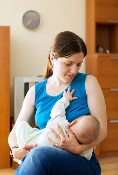 Mother breast feeding half-year-old baby — Stock Photo, Image