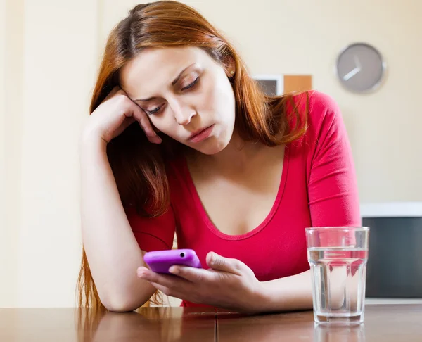 Crying lonely girl with mobile — Stock Photo, Image