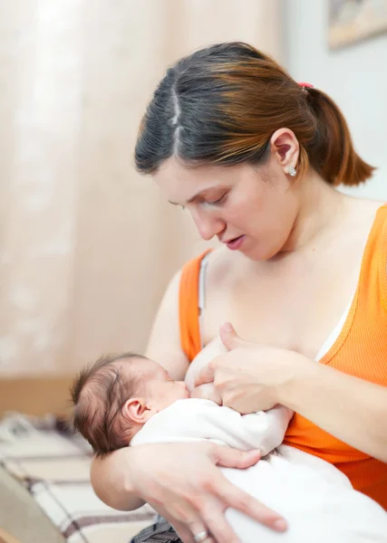 Nursing newborn baby at home — Stock Photo, Image