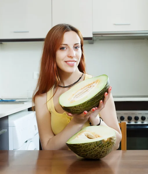 Positive girl with ripe melon — Stock Photo, Image