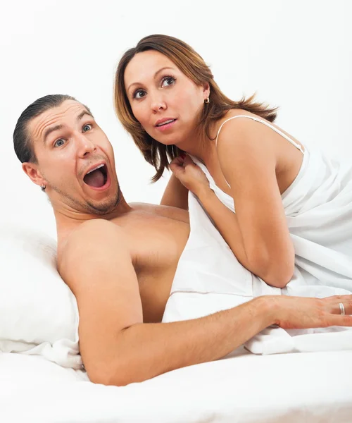 Middle-aged couple caught in bed — Stock Photo, Image