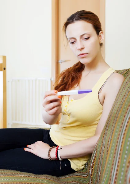 Serious girl with pregnancy test — Stock Photo, Image