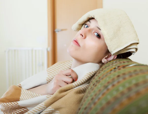 Woman in plaid stupes towel to head — Stock Photo, Image