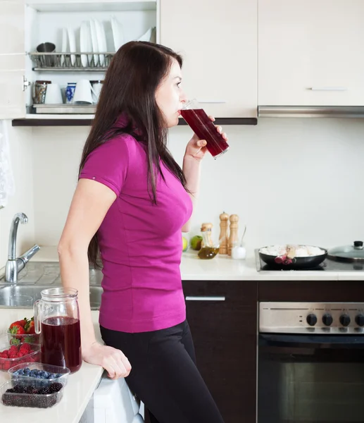 Woman drinking fresh fruit-drink from glass — Stock Photo, Image