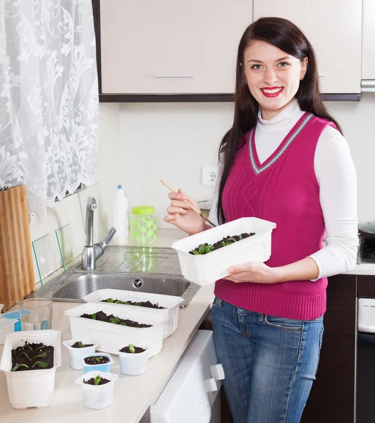 Happy woman with sprouts — Stock Photo, Image