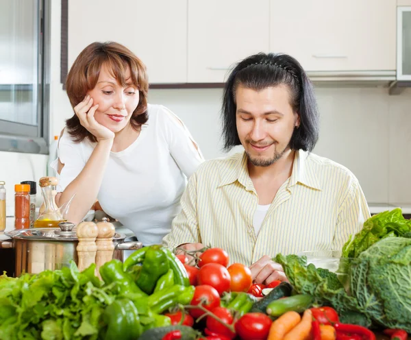 Flirting couple cooking together — Stock Photo, Image