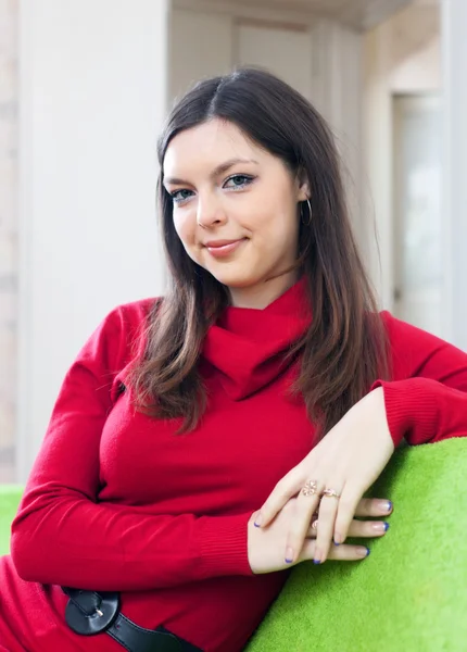 Girl in red at home — Stock Photo, Image