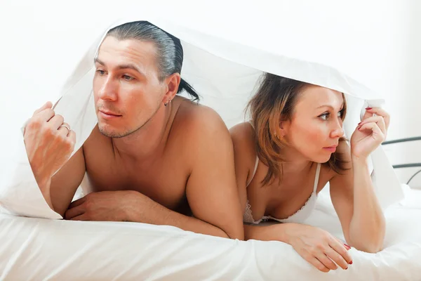 Unhappy man and woman having problem in bed — Stock Photo, Image