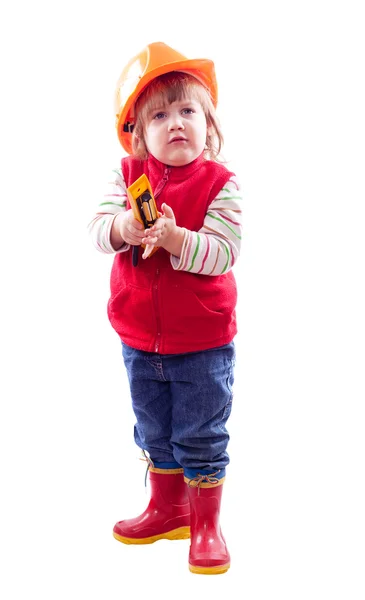 Child in hardhat with tool — Stock Photo, Image