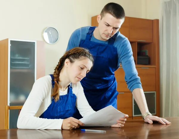 Workers in uniform with documents — Stock Photo, Image