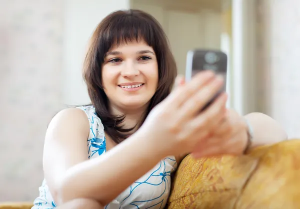 Ordinary woman reads SMS — Stock Photo, Image